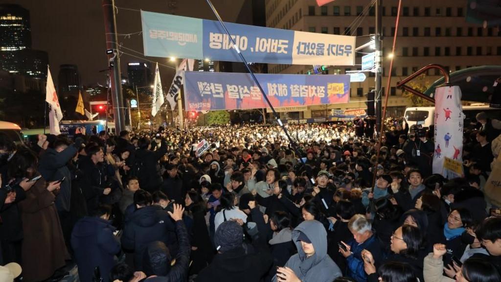 South Korea president backs down from martial law order after MPs vote to block it